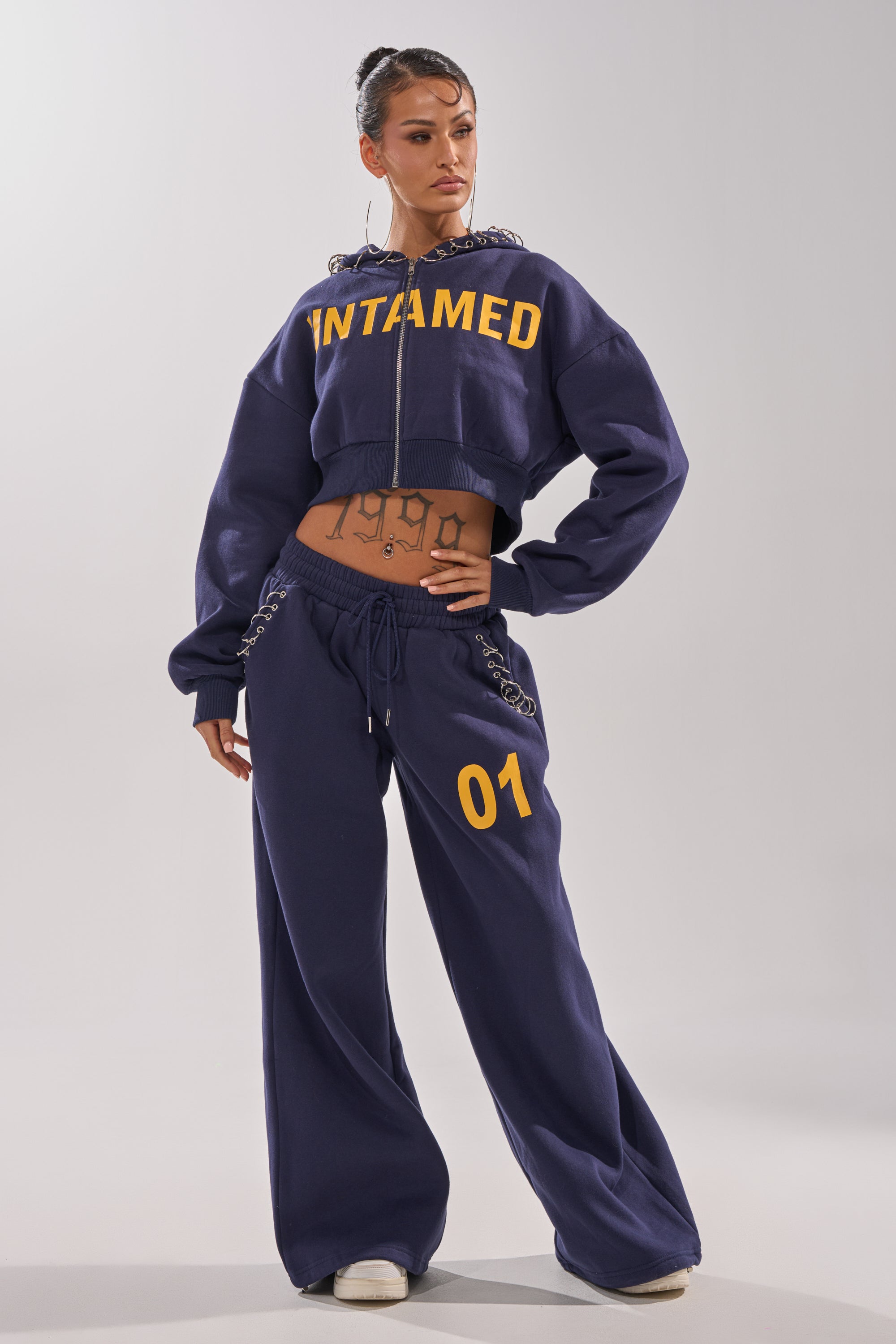 UNTAMED METAL RING SWEATSHIRT